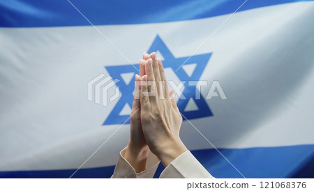 Jewish Woman Praying On Star Of David Israeli National Flag. Hopeful Prayer 121068376
