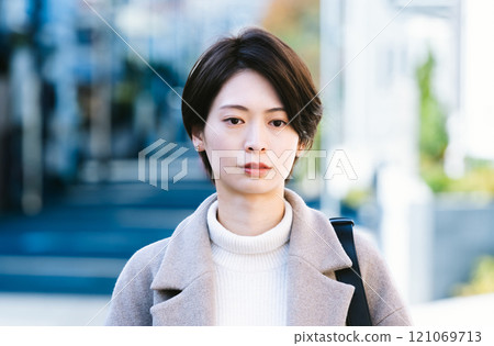 A woman in a coat 121069713