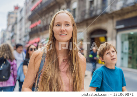 Mother and teenage son tourists in the central square of Mexico City, Zocalo. Family travel, cultural exploration, and historic architecture concept 121069871
