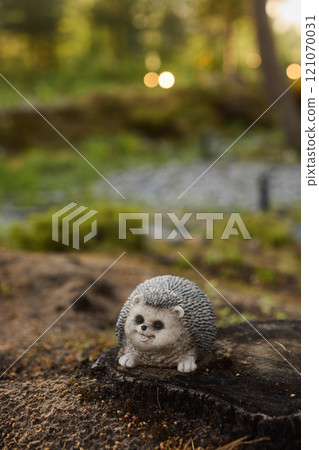 Charming and Delightful Hedgehog Figurine Nestled in a Beautiful Natural Setting Outdoors Charming and Delightful Hedgehog Figurine Nestled in a Beautiful Natural Setting Outdoors 121070031