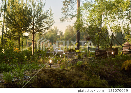 A Serene Garden Oasis at Dusk, complete with Relaxing Seating for True Comfort and Escape 121070059