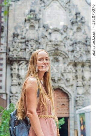 Female tourist in the central square of Mexico City, Zocalo. Cultural exploration, travel, and historic architecture concept 121070070
