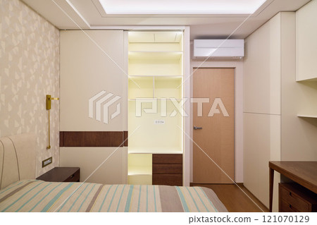 A Modern Bedroom with WellOrganized Closet Space and Efficient Air Conditioning System 121070129