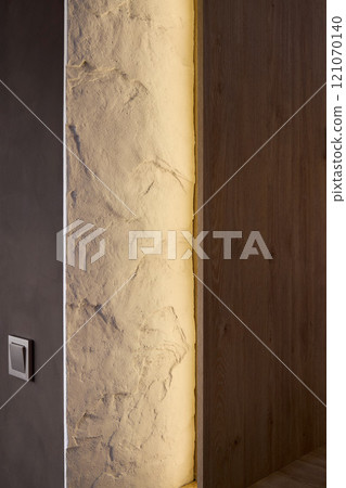 Explore an Elegant Wall Design with Backlighting and a Textured Finish that uplifts any space 121070140
