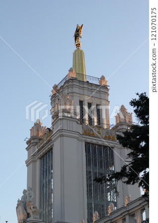 This is an Architectural Marvel featuring a stunning Golden Statue atop the Tower 121070175