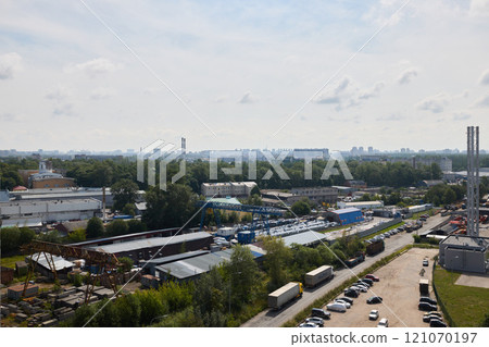 An Urban Industrial Landscape featuring lush Greenery contrasted by a stunning City Skyline An Urban Industrial Landscape featuring lush Greenery contrasted by a stunning City Skyline 121070197