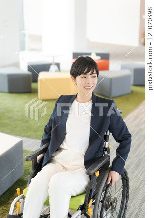 Working female wheelchair user 121070398