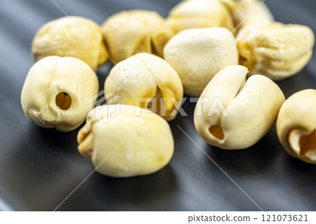 Closeup view of lotus seeds (Nelumbo nucifera) in the bowl 121073621