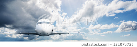 Commercial airplane flying in the sky with cloudscapes background 121073725