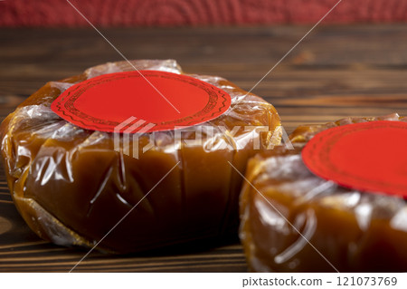 Chinese New Year rice cake or Nian Gao on the table. Also popular as Kue Keranjang or Dodol China 121073769