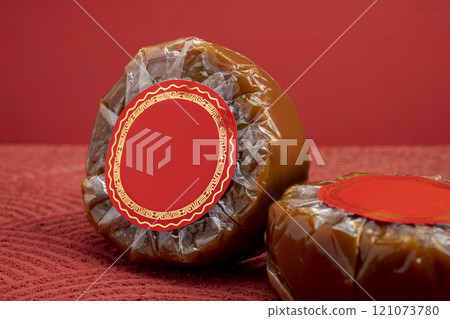 Chinese New Year rice cake or Nian Gao on the table. Also popular as Kue Keranjang or Dodol China Chinese New Year rice cake or Nian Gao on the table. Also popular as Kue Keranjang or Dodol China 121073780