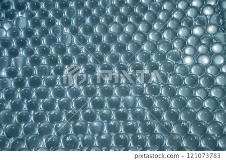 Blue water gel balls. Polymer gel. Silica gel. Balls of hydrogel round shape. Crystal liquid ball with reflection. Water beads 121073783