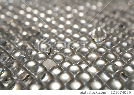 White water gel balls. Polymer gel. Silica gel. Balls of hydrogel round shape. Crystal liquid ball with reflection. Water beads White water gel balls. Polymer gel. Silica gel. Balls of hydrogel round shape. Crystal liquid ball with reflection. Water beads 121074039