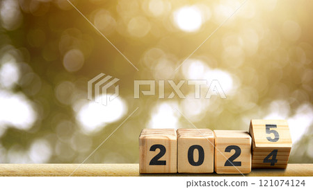 Wooden cubes transform from number 2024 to 2025 on the table 121074124