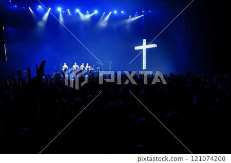 people silhouette with raised hands at christian concert worship God and Jesus Christ, on blue background. Christian concept 121074200
