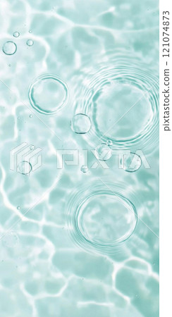 Ripples in clear blue water with abstract circular patterns, suitable as calming SPA background 121074873