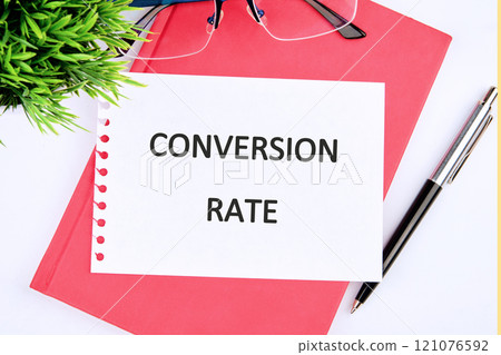 Business concept. The conceptual text of the CONVERSION RATE close-up, on a white sheet of notepad Business concept. The conceptual text of the CONVERSION RATE close-up, on a white sheet of notepad 121076592