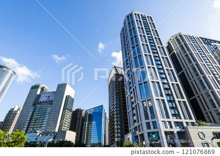 Low-angle view of New Taipei City Government building and other modern buildings in Banqiao, Taiwan. 121076869