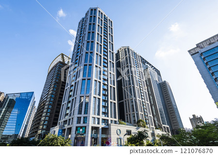Low-angle view of New Taipei City Government building and other modern buildings in Banqiao, Taiwan. 121076870
