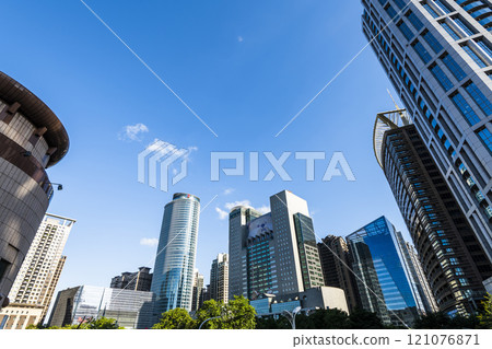 Low-angle view of New Taipei City Government building and other modern buildings in Banqiao, Taiwan. 121076871