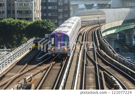 View of a Taoyuan International Airport line train running on the elevated track of the Taoyuan Mass Rapid Transit System. 121077224