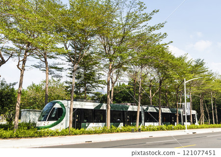The circular light rail train drives past the Kaohsiung Museum of Fine Arts station in Taiwan. 121077451