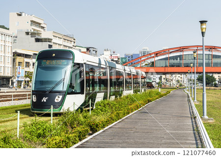 The circular light rail train drives past Hamasen Railway Cultural Park in Kaohsiung, Taiwan. 121077460