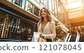 Beautiful young model is shopping in a large department store. 121078045