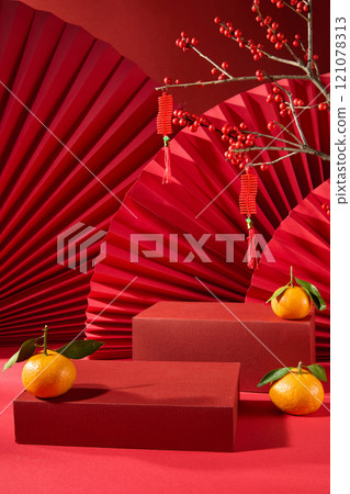 The Chinese New Year idea, the front of two red podiums with a blank space for showcasing products, is adorned by winterberry hanging a lucky string, tangerines, and some red paper fans. The Chinese New Year idea, the front of two red podiums with a blank space for showcasing products, is adorned by winterberry hanging a lucky string, tangerines, and some red paper fans. 121078313