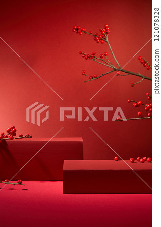 Chinese New Year concept on crimson backgrounds, featuring a close-up of empty red rectangular podiums for placing products, adorned with winterberry branches and red berry fruits. 121078328
