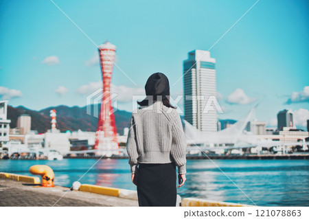 Kobe cityscape and the back of a woman Kobe cityscape and the back of a woman 121078863