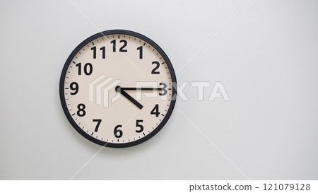 Classic Black-Edged Clock on White Background at 16.15/04.15 - Perfect for Time Management and Text Space Classic Black-Edged Clock on White Background at 16.15/04.15 - Perfect for Time Management and Text Space 121079128