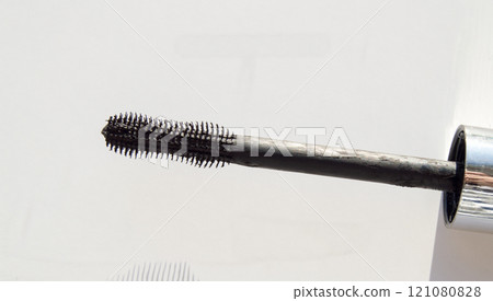 Close-up of a black mascara brush isolated on a white background 121080828