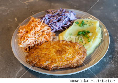 Meat dish on table homemade with salads Meat dish on table homemade with salads 121081517