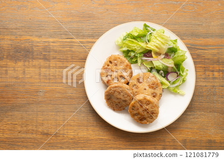 Grilled lotus root sandwiched with minced meat Grilled lotus root sandwiched with minced meat 121081779