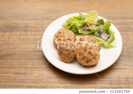 Grilled lotus root sandwiched with minced meat Grilled lotus root sandwiched with minced meat 121081784