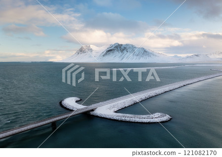 Iceland. Aerial view of the road. View from a drone. Winter landscape from air. Iceland. Aerial view of the road. View from a drone. Winter landscape from air. 121082170