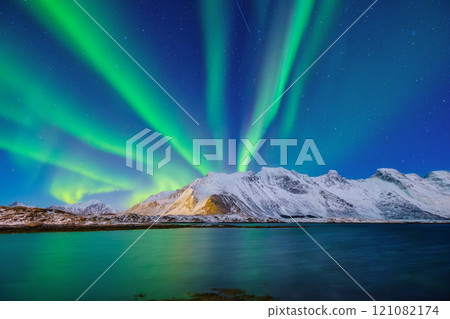 Aurora Borealis in Scandinavia. Norway, Lofoten islands. Northern lights over the mountains. 121082174