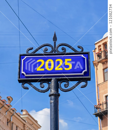 Business concept of 2025 new year symbol. Beautiful blue old retro road sign with number 2025. Beautiful blue sky and city building background, copy space. Business 2025 happy new year concept. Business concept of 2025 new year symbol. Beautiful blue old retro road sign with number 2025. Beautiful blue sky and city building background, copy space. Business 2025 happy new year concept. 121082734