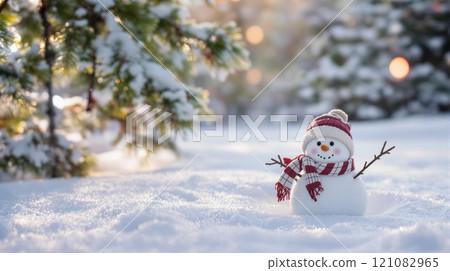 Winter holidays christmas background banner - close up of cute funny smiling snowman wearing woolen hat and scarf Winter holidays christmas background banner - close up of cute funny smiling snowman wearing woolen hat and scarf 121082965