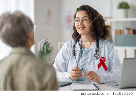 patient and a doctor in medical office 121083150
