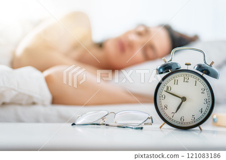 woman is sleeping in the bedroom 121083186