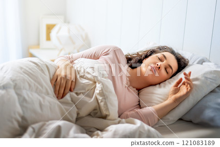 woman is sleeping in the bedroom woman is sleeping in the bedroom 121083189