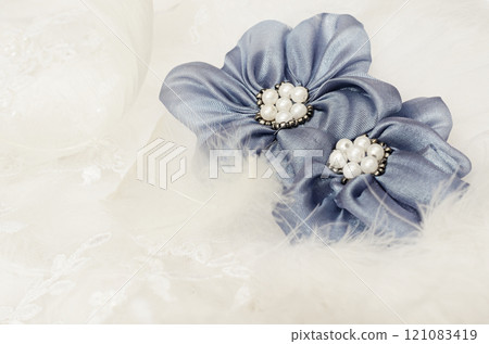 Blue flowers on white lace 121083419