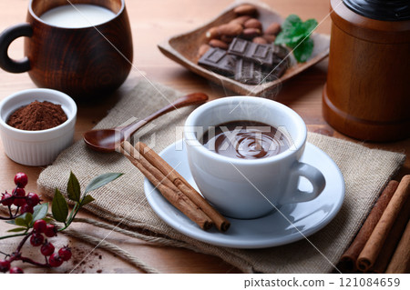 Warming hot cocoa with the scent of cinnamon Warming hot cocoa with the scent of cinnamon 121084659