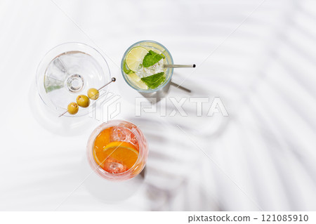 A vibrant display of cocktails, including Aperol Spritz, Mojito, and Martini A vibrant display of cocktails, including Aperol Spritz, Mojito, and Martini 121085910