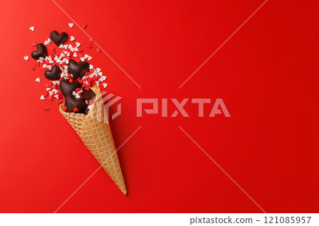 A heart-shaped sweets in an ice cream cone - Valentine's Day A heart-shaped sweets in an ice cream cone - Valentine's Day 121085957