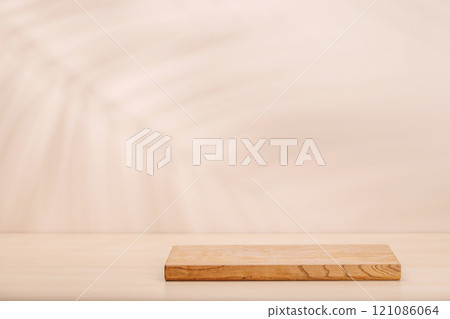 Template with board on table and wall with natural plant shadow and sunny glare Template with board on table and wall with natural plant shadow and sunny glare 121086064