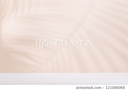 Template with empty table and wall with natural plant shadow and sunny glare Template with empty table and wall with natural plant shadow and sunny glare 121086068