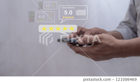 Customer Review, Young Man hand using smartphone mobile with five star to review and give 5 stars Customer Review, Young Man hand using smartphone mobile with five star to review and give 5 stars 121086469